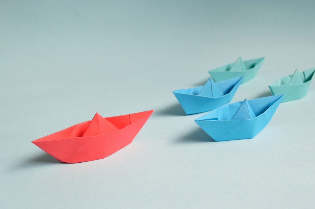 Paper boats on solid surface
