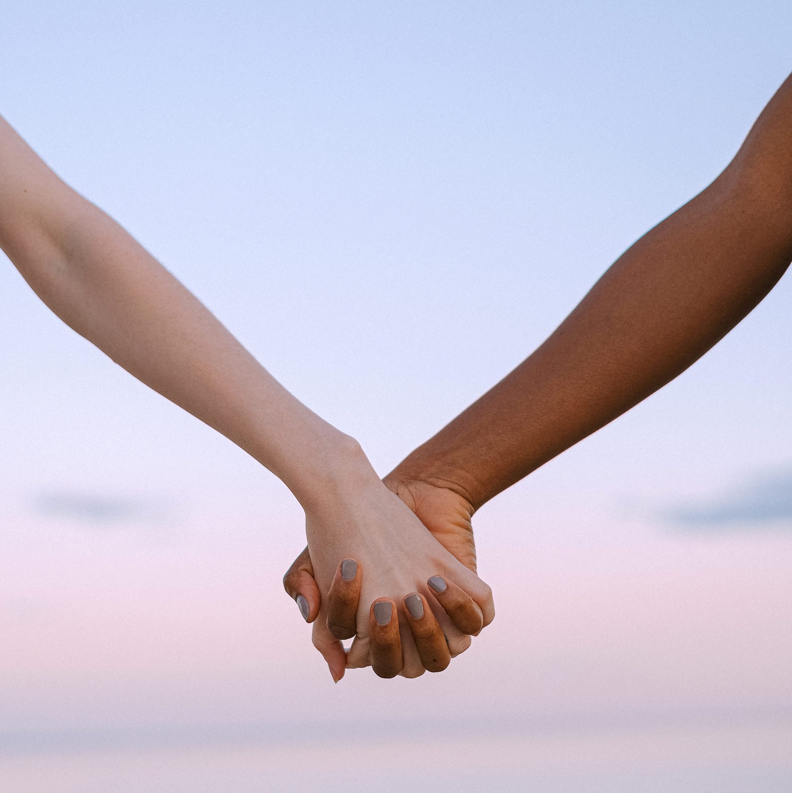 Photo of people holding hands